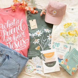 Flat Lay of graphic tees and additional accessories in a Flat Lay
