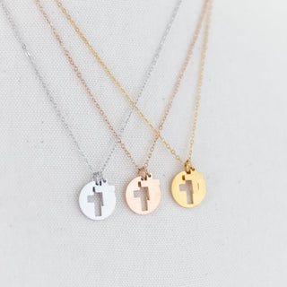 Three Cross Necklaces on a display