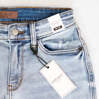 Judy Blue Light Distressed Denim Shorts with Mid Rise Waist - Bennett Avenue Boutique