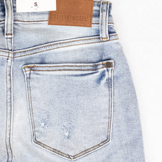 Judy Blue Light Distressed Denim Shorts with Mid Rise Waist - Bennett Avenue Boutique