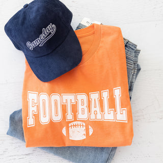 Game Day Tee Team Colors Orange and White Graphic Tee with a navy blue Gameday hat and jeans
