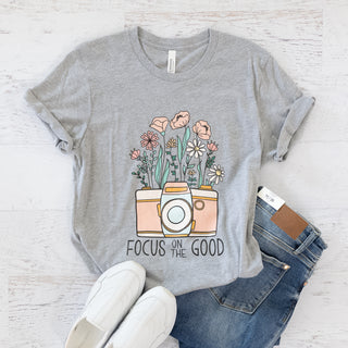 Heather grey graphic tee featuring a camera with wildflowers and the text Focus on the Good