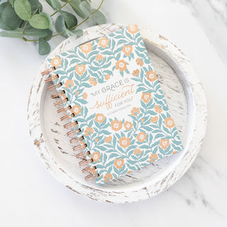 My Grace is Sufficient For You 2 Corinthians 12:9 journal with floral cover on a white wooden tray