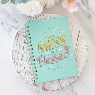 Hot Mess But I am Blessed spiral wire bound mint green journal on a white wooden tray