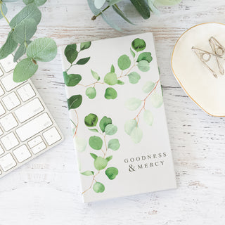 He Restores My Soul Psalm 23:3 Goodness and Mercy notepad with eucalyptus leaf design on a white desk