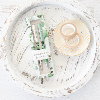 Goodness and Mercy He Restores My Soul pen set in floral packaging on a white wooden tray with washi tape