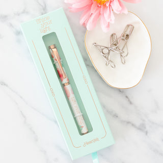 Shine Your Light Heartfelt ball point pen in mint green packaging on marble surface
