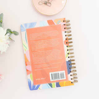 Back cover of Moms Faith Journey A Year of Reflections and Testimony journal with floral pattern and text summary