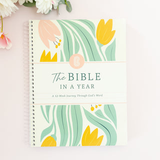 The Bible in A Year A 52-Week Journey Through God's Word spiral bound book with floral cover art