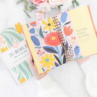 Open Moms Faith Journey A Year of Reflections and Testimony journal with floral pages and text about family faith