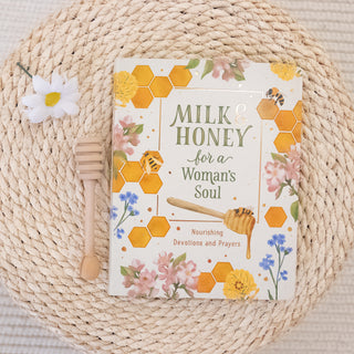 Milk & Honey for a Women's Soul Devotional for Women book with honey dipper and floral decor on woven mat Christian Faith-based Boutique