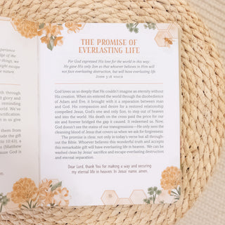 Open devotional book page titled The Promise of Everlasting Life from Milk & Honey for a Women's Soul Devotional for Women on woven mat background Christian Faith-based Boutique