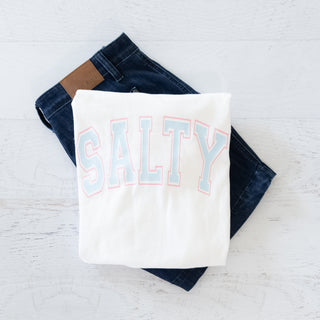White t-shirt with 'SALTY' text on a white background