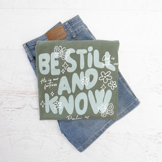 Be Still and Know Psalm 46 Deep Olive Graphic tee with light blue text and butterflies