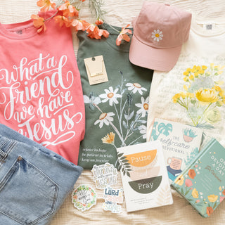 Little Bit of Everything Bundle featuring t-shirts, a baseball cap, devotional books, stickers, and a necklace