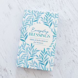 Book titled 'Everyday Blessings' with a leaf pattern on a light wooden surface