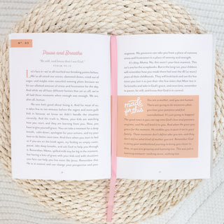 Open devotional book titled Pause and Breathe with pink ribbon on woven surface Faith & Self-Care Gift Box for Moms on Mother's Day Christian Faith-based Boutique