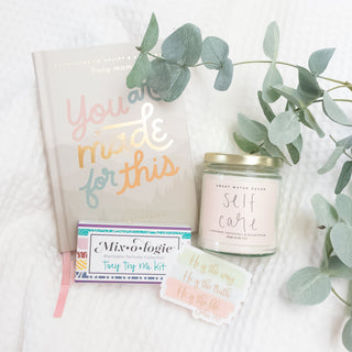 Faith & Self-Care Gift Box for Moms on Mother's Day with devotional book, scented candle, perfume kit, and Christian faith-based stickers.